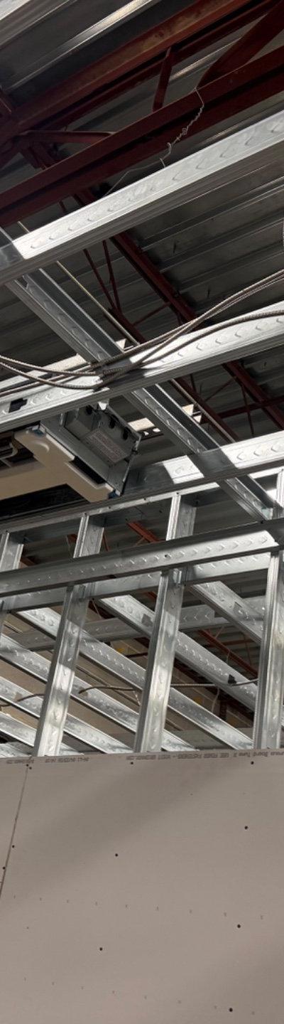 HVAC ductless mini-split installation within new commercial framing and exposed ceiling.