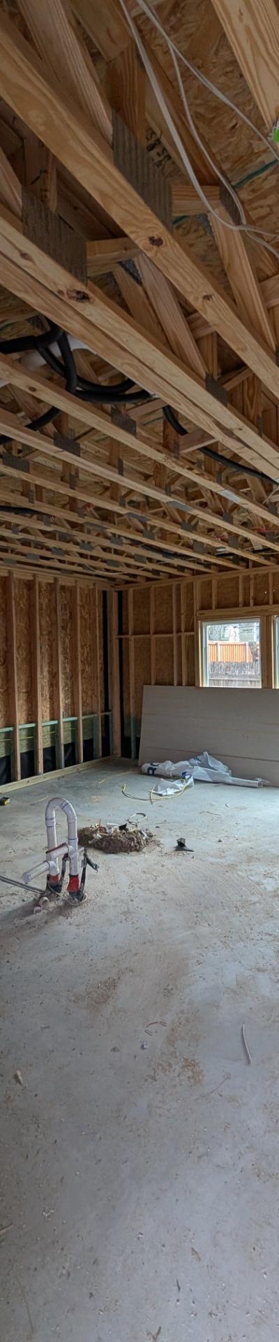 HVAC flexible ductwork installation in exposed ceiling joists of new residential construction.